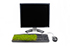 A desktop PC with grass growing out of the keyboard