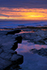 Sunrise reflected in rock pools on the northeast coast of England