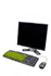 A desktop computer with grass growing out of the keyboard