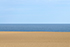 A ploughed and raked field on the coast